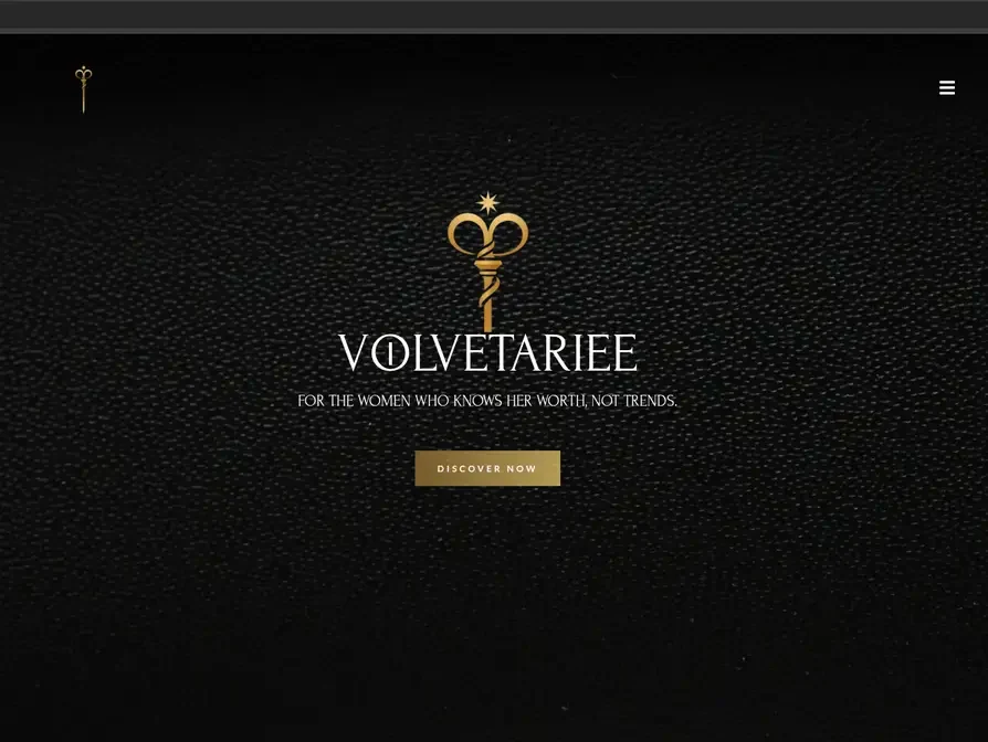 Volvetariee fashion website with a gold emblem on a black textured background